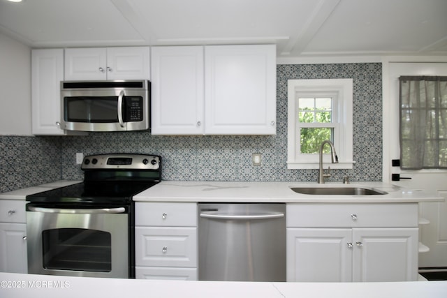 41 Eagle Dr, Whiting, NJ 08759 - kitchen with appliances with stainless steel finishes, a sink, white cabinets, and light countertops