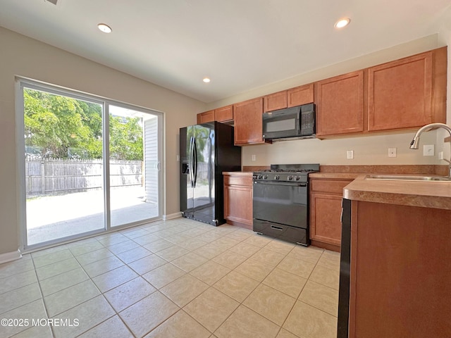143 2nd Ave, Toms River, NJ 08757 - kitchen with black appliances, a sink, light tile patterned floors, baseboards, and recessed lighting