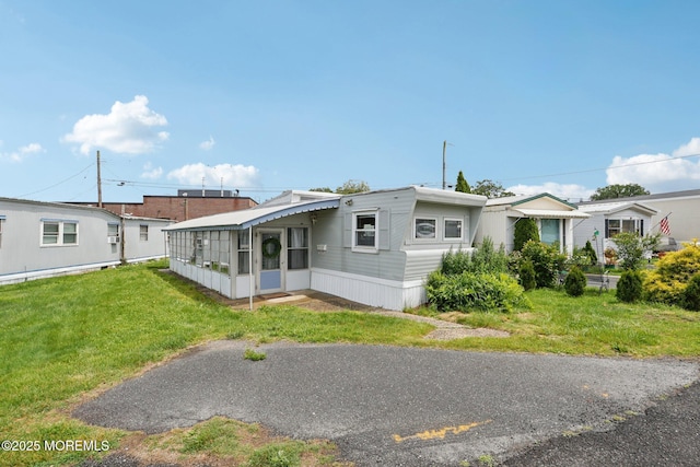 220 W Sylvania Ave Unit 16, Neptune City, NJ 07753 - view of front of property with a sunroom and a front yard