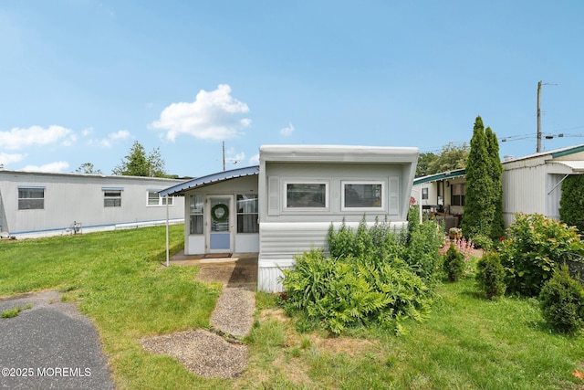 220 W Sylvania Ave Unit 16, Neptune City, NJ 07753 - manufactured / mobile home featuring a front lawn