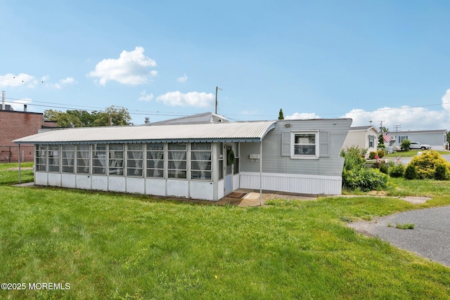 220 W Sylvania Ave Unit 16, Neptune City, NJ 07753 - rear view of property with a yard and a sunroom