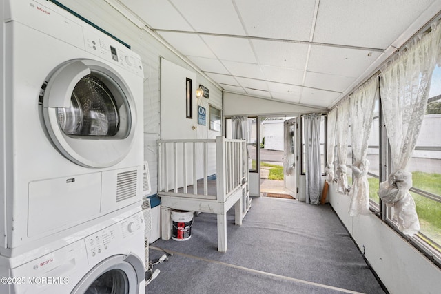 220 W Sylvania Ave Unit 16, Neptune City, NJ 07753 - laundry area with stacked washer / dryer, healthy amount of natural light, and carpet flooring