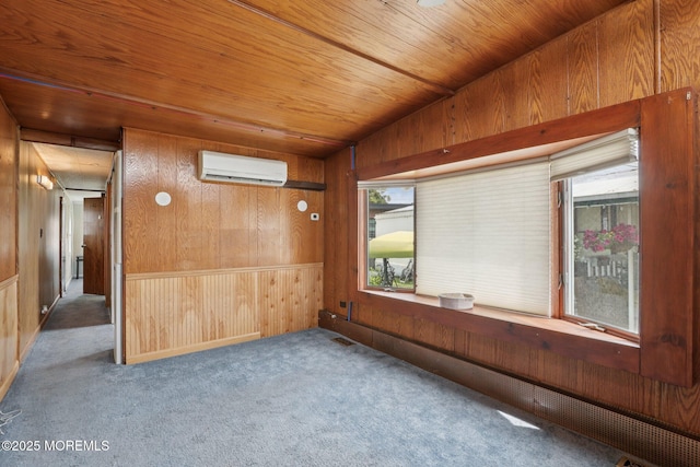220 W Sylvania Ave Unit 16, Neptune City, NJ 07753 - carpeted empty room with an AC wall unit, wood walls, and wood ceiling