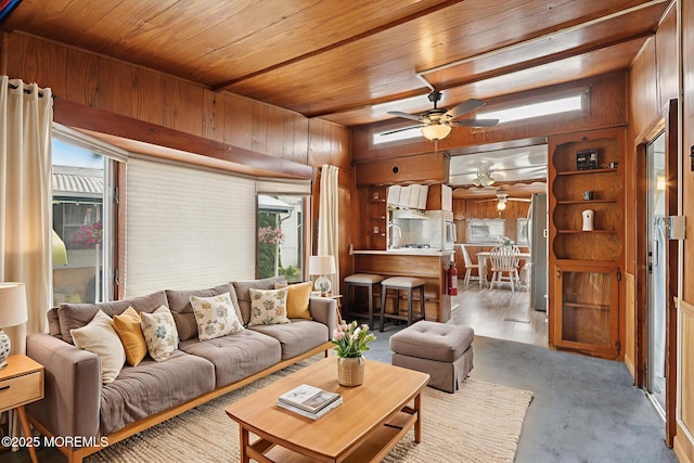 220 W Sylvania Ave Unit 16, Neptune City, NJ 07753 - living room featuring ceiling fan, wooden walls, and wooden ceiling