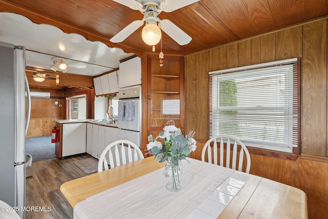 220 W Sylvania Ave Unit 16, Neptune City, NJ 07753 - dining area with wood walls, ceiling fan, wood ceiling, and dark wood finished floors
