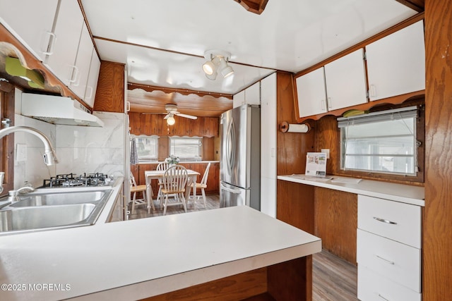 220 W Sylvania Ave Unit 16, Neptune City, NJ 07753 - kitchen with freestanding refrigerator, a ceiling fan, light countertops, decorative backsplash, and white cabinets