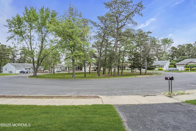 32 Bugle Ct, Toms River, NJ 08757 - view of asphalt road with a residential view