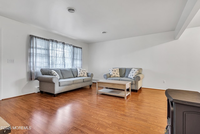 32 Bugle Ct, Toms River, NJ 08757 - living area featuring light wood-style floors, a baseboard heating unit, and baseboards