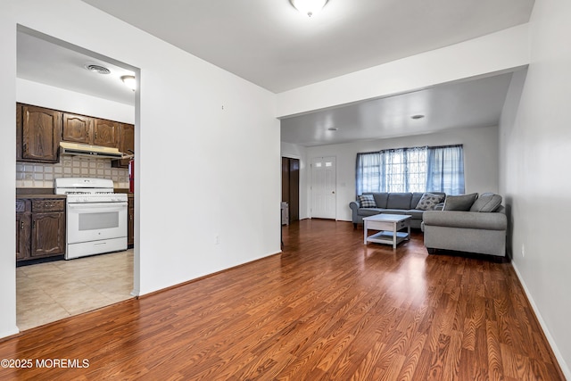 32 Bugle Ct, Toms River, NJ 08757 - living area with light wood-style flooring and baseboards