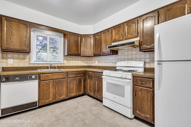 32 Bugle Ct, Toms River, NJ 08757 - kitchen featuring white appliances, under cabinet range hood, a sink, and tasteful backsplash