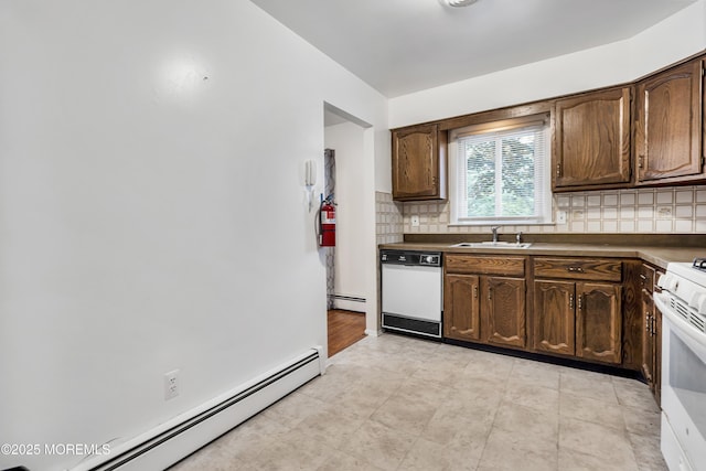 32 Bugle Ct, Toms River, NJ 08757 - kitchen with a baseboard heating unit, white appliances, a sink, and decorative backsplash