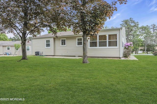 32 Bugle Ct, Toms River, NJ 08757 - rear view of house with a lawn and central AC