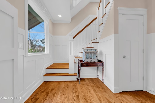 3 Sunset Dr, Asbury Park, NJ 07712 - stairs featuring a decorative wall, wood finished floors, and wainscoting