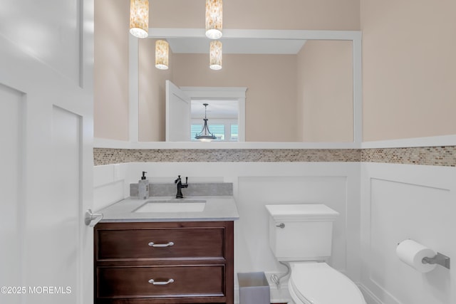 3 Sunset Dr, Asbury Park, NJ 07712 - half bathroom with toilet, vanity, and tile walls