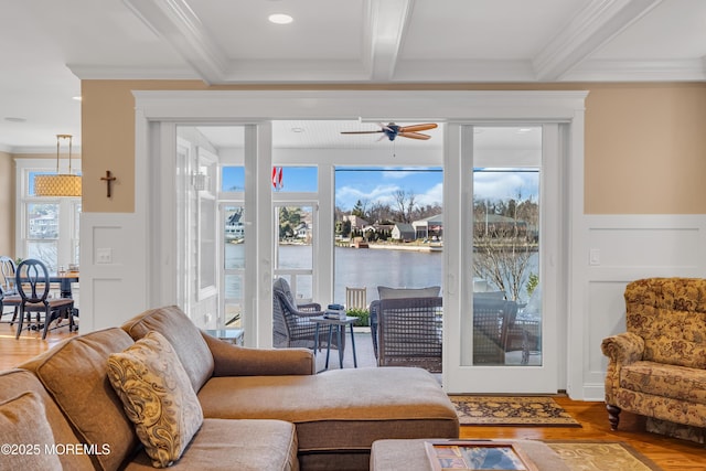 3 Sunset Dr, Asbury Park, NJ 07712 - living room with beamed ceiling, ceiling fan, ornamental molding, wood finished floors, and plenty of natural light