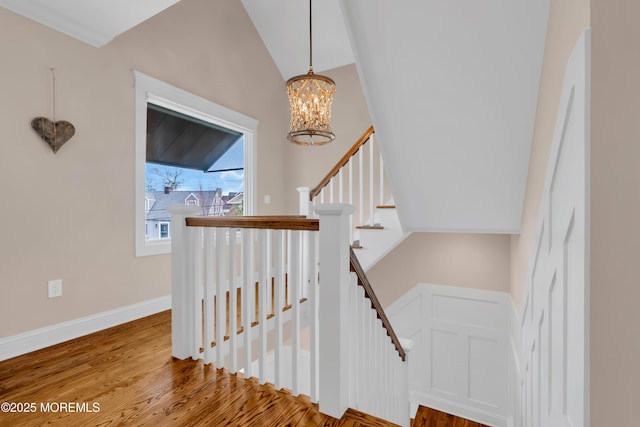3 Sunset Dr, Asbury Park, NJ 07712 - staircase featuring a chandelier, wood finished floors, and vaulted ceiling