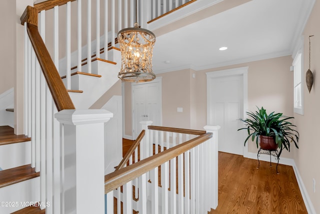 3 Sunset Dr, Asbury Park, NJ 07712 - stairs with a chandelier, wood finished floors, baseboards, ornamental molding, and recessed lighting