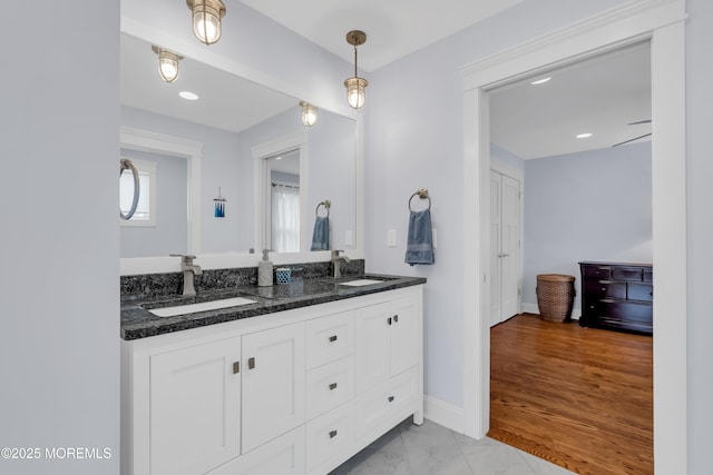 3 Sunset Dr, Asbury Park, NJ 07712 - bathroom with double vanity and baseboards