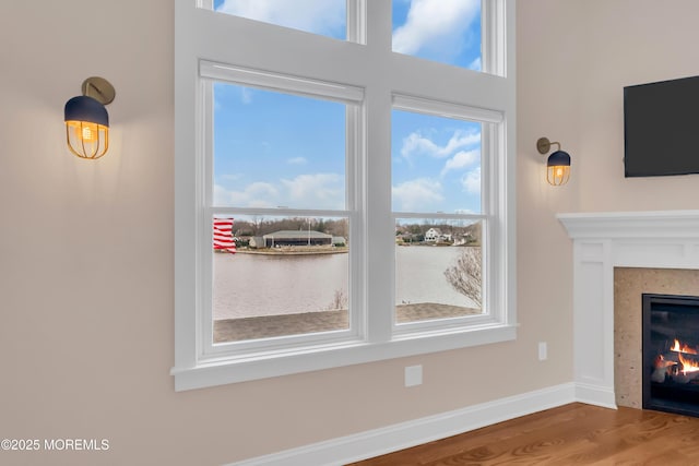 3 Sunset Dr, Asbury Park, NJ 07712 - detailed view of a warm lit fireplace, wood finished floors, and baseboards