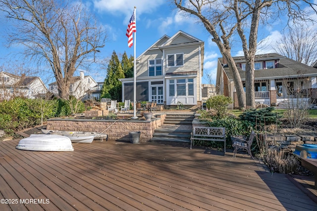 3 Sunset Dr, Asbury Park, NJ 07712 - wooden deck featuring a sunroom