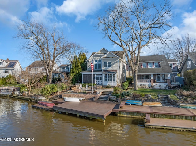 3 Sunset Dr, Asbury Park, NJ 07712 - back of property with a sunroom, a water view, and a residential view