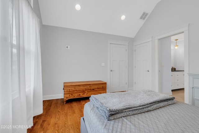 3 Sunset Dr, Asbury Park, NJ 07712 - bedroom featuring lofted ceiling, light wood-type flooring, baseboards, recessed lighting, and connected bathroom