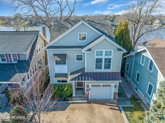 3 Sunset Dr, Asbury Park, NJ 07712 - view of front facade with a standing seam roof, a garage, decorative driveway, and a shingled roof