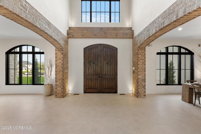 1 Preakness Way, Colts Neck, NJ 07722 - entryway featuring a towering ceiling, plenty of natural light, and arched walkways