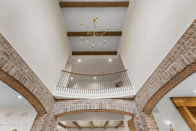 1 Preakness Way, Colts Neck, NJ 07722 - staircase with a high ceiling and a chandelier