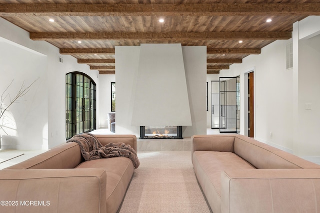 1 Preakness Way, Colts Neck, NJ 07722 - living area with wooden ceiling, a multi sided fireplace, beamed ceiling, recessed lighting, and carpet flooring