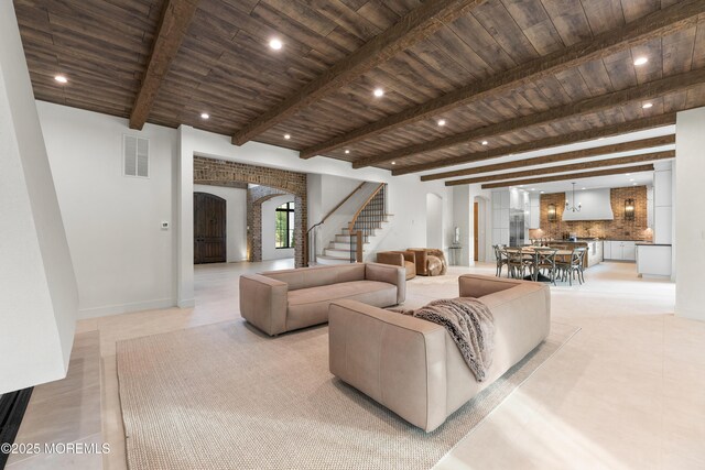 1 Preakness Way, Colts Neck, NJ 07722 - living area with arched walkways, stairs, wooden ceiling, beam ceiling, and recessed lighting