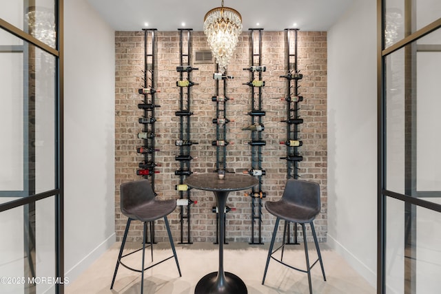 1 Preakness Way, Colts Neck, NJ 07722 - wine area featuring brick wall, baseboards, a chandelier, and recessed lighting