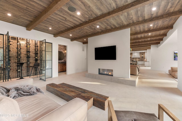 1 Preakness Way, Colts Neck, NJ 07722 - living area featuring wooden ceiling, beamed ceiling, a glass covered fireplace, recessed lighting, and baseboards