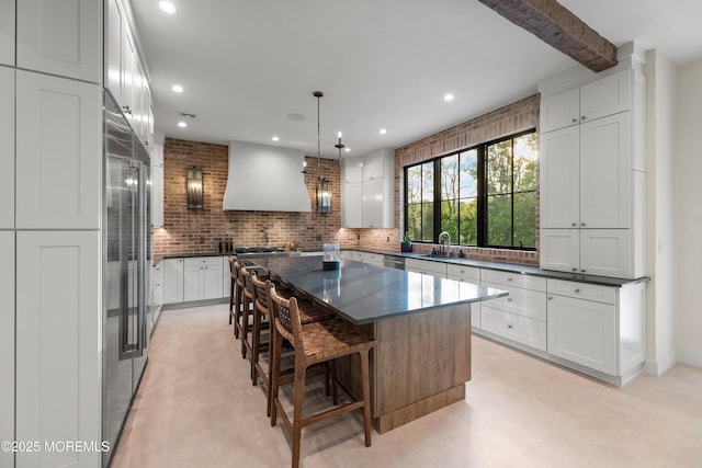 1 Preakness Way, Colts Neck, NJ 07722 - kitchen featuring custom range hood, a kitchen island, recessed lighting, decorative backsplash, and white cabinetry