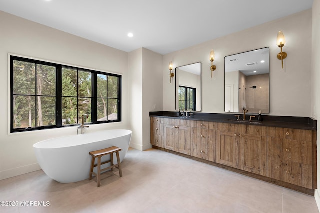 1 Preakness Way, Colts Neck, NJ 07722 - bathroom featuring baseboards, a freestanding bath, double vanity, a shower, and recessed lighting