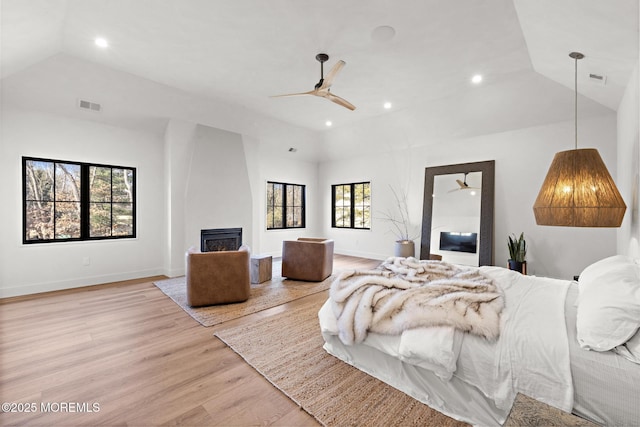 1 Preakness Way, Colts Neck, NJ 07722 - bedroom with light wood-style floors, lofted ceiling, recessed lighting, baseboards, and a fireplace
