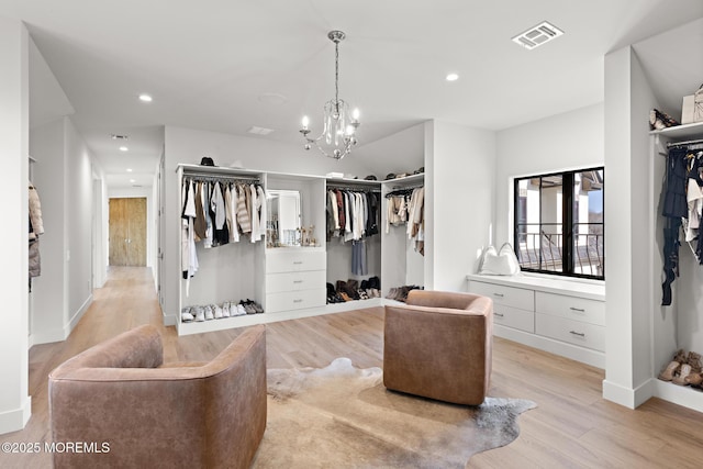 1 Preakness Way, Colts Neck, NJ 07722 - spacious closet with light wood finished floors and a chandelier