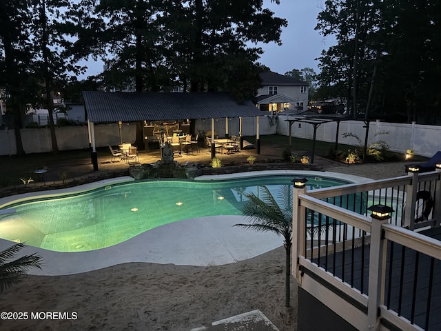 view of swimming pool with a fenced backyard and a patio