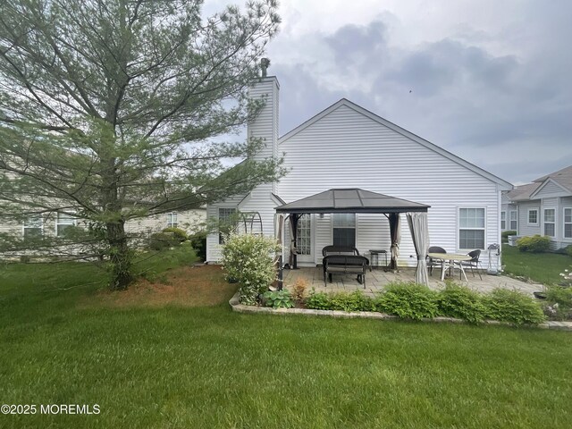 6 Ravenna Rd, Manchester, NJ 08759 - rear view of house with a patio area, a gazebo, a yard, and a chimney