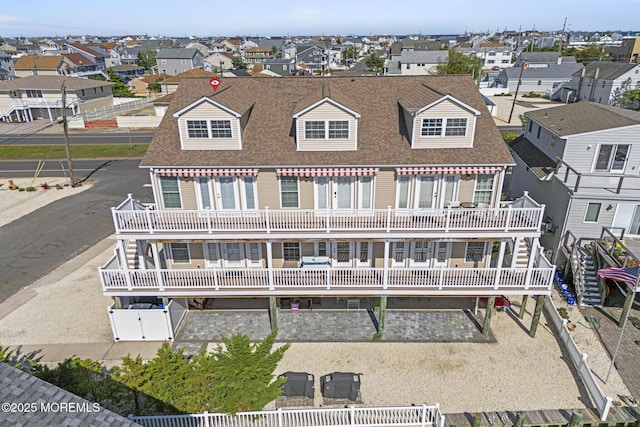 1707 Bay Blvd Unit 4, Seaside Heights, NJ 08751 - back of house with a residential view and a shingled roof
