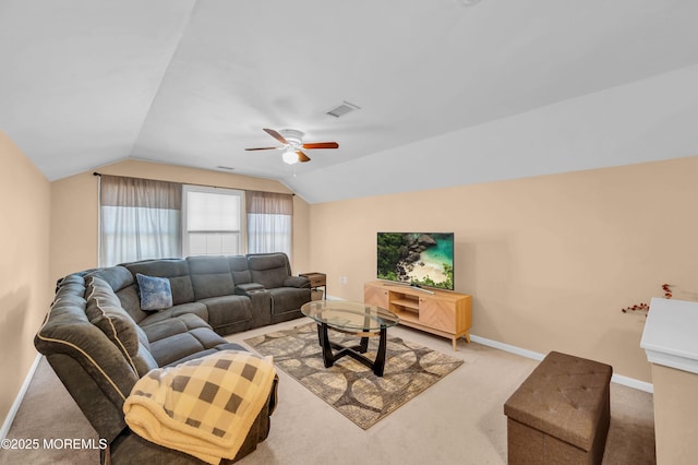 living room featuring light colored carpet, lofted ceiling, a ceiling fan, and baseboards