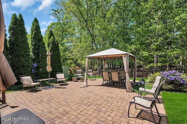view of patio / terrace featuring a gazebo and fence