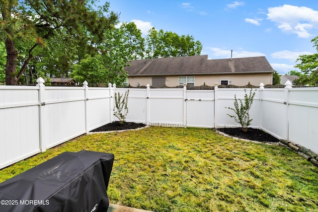 view of yard with a gate