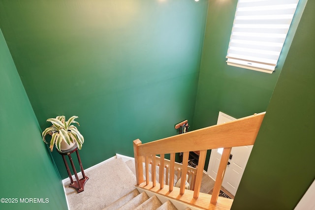 stairway with carpet and baseboards