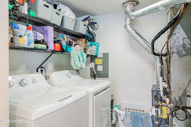clothes washing area featuring separate washer and dryer