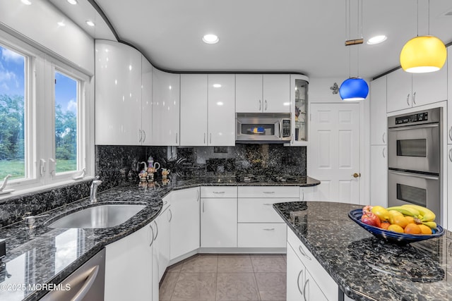 8 Eileen Ln, Marlboro, NJ 07746 - kitchen with appliances with stainless steel finishes, white cabinets, a sink, decorative backsplash, and recessed lighting
