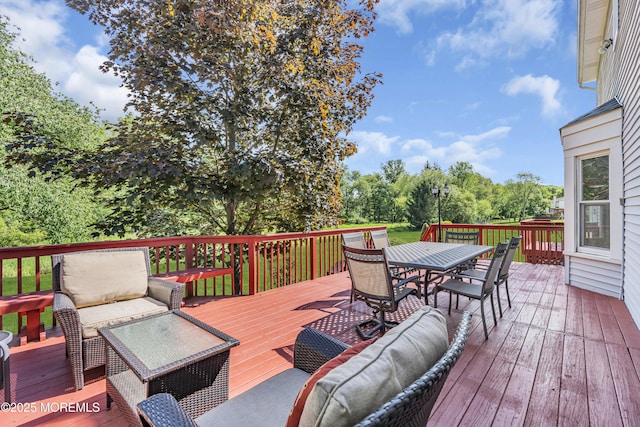 8 Eileen Ln, Marlboro, NJ 07746 - wooden deck featuring outdoor dining space and view of scattered trees