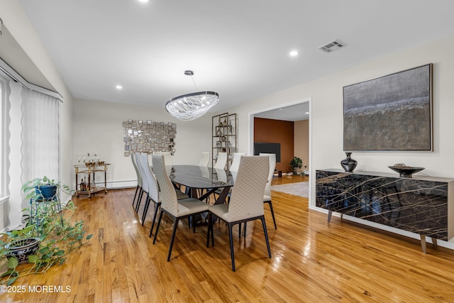 8 Eileen Ln, Marlboro, NJ 07746 - dining room with light wood finished floors, a chandelier, recessed lighting, and baseboard heating