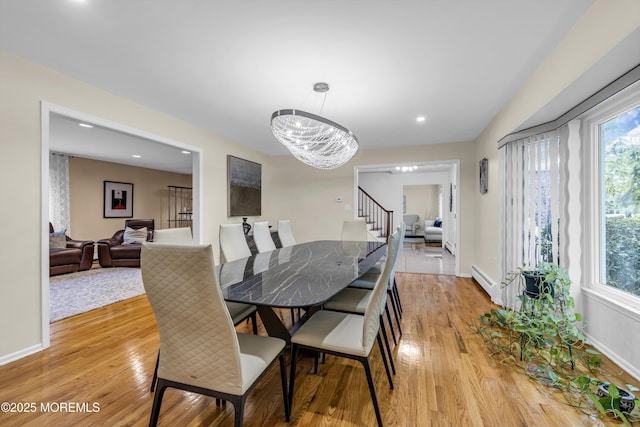 8 Eileen Ln, Marlboro, NJ 07746 - dining space featuring a baseboard radiator, light wood finished floors, stairs, a chandelier, and recessed lighting