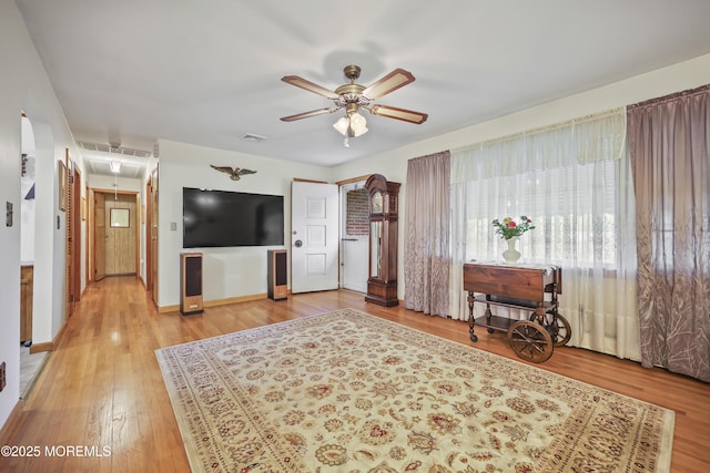 624 Lloyd Rd, Aberdeen, NJ 07747 - living room featuring ceiling fan, attic access, baseboards, and light wood-style flooring